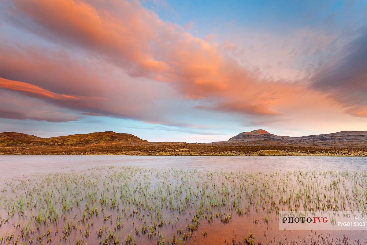 The colors of the sunset reflected in the water