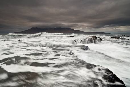 Singing Sands bay, Isle of Eigg with the Rum mountains in the distance