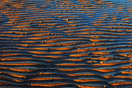 Patterns on the sand at sunrise