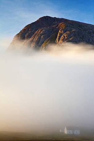 Mist and low cloud surrounding a cottage