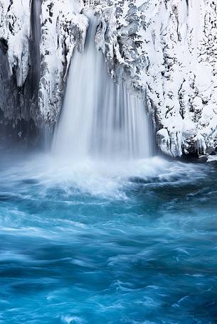 The frozen detail of a small waterfall nearby Godafoss.