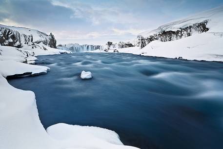 Godafoss waterfalls captured from below, after an intense period of snowfalls.