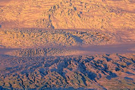 A detail of colourful Vatnajkull ice at the first light of sunrise.
