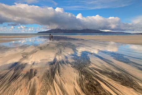 During a peaceful day, Laig Bay shows the epic size of nature