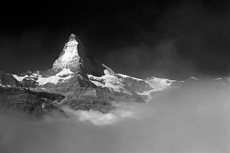 The Great Summit of Matterhorn with his beautiful shape shows up from the clouds