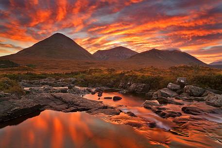 The sky above the Red Cuillin looks like a fireworks show during an impressive sunrise
