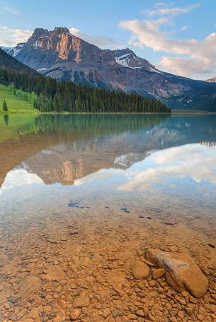 Reflections into the Emerald Lake water at late Afternoon