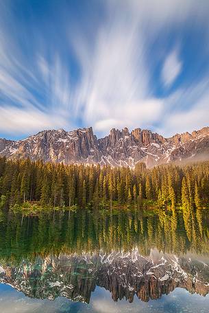 The Beauty of Dolomites captured from Carezza Lake at dusk The Beauty of Dolomites captured from Carezza Lake at dusk