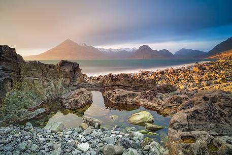 The Cuillin Hills view from Elgol Beach is simply amazing. Thanks to the long time exposure this picture shows the contrast between the static rocks and the dynamic sky on the background
