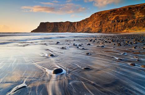 Last light in the afternoon hits the North cliffs of Talisker Bay