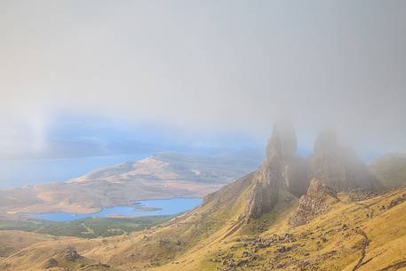 The clouds embraced the famous pinnacle of Old Man of Storr during a misty morning The clouds embraced the famous pinnacle of Old Man of Storr during a misty morning