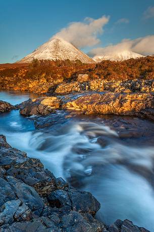 The golden light in the afternoon kisses the landscape at Sligachan