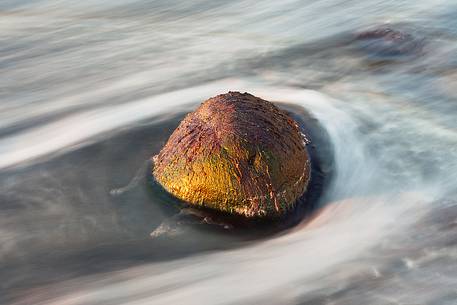 A green stone shows up during the low tide at Talisker Bay