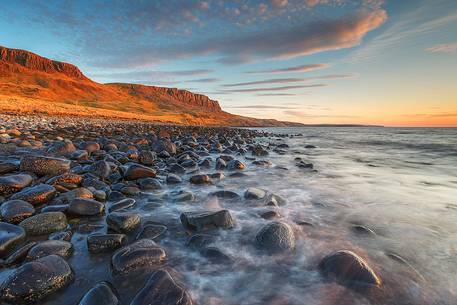 A nice sunset at Score Bay where the pebbles are submerged by the high tide