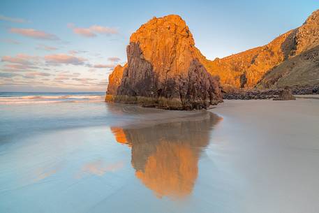 During the low tide is possible to reach the sea stack on the beaches of north Lewis. During the sunset time they become redish During the low tide is possible to reach the sea stack on the beaches of north Lewis. During the sunset time they become redish