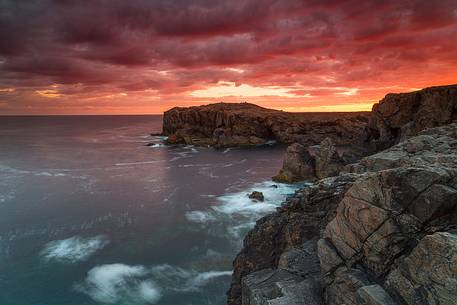 The sky in on fire at sunrise from the cliffs of Shawbost