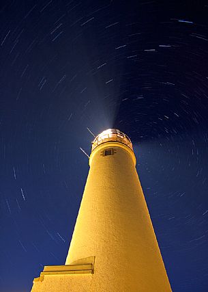 During the afterglow the lighthouse goes on creating a nice contrast on the water