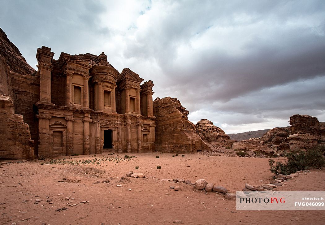 Al Deir Monastery facade view in a cloudy day in Petra, Jordan