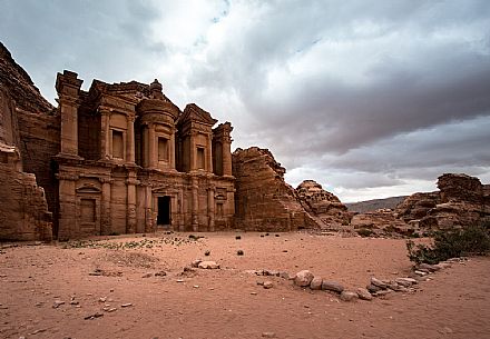 Al Deir Monastery facade view in a cloudy day in Petra, Jordan