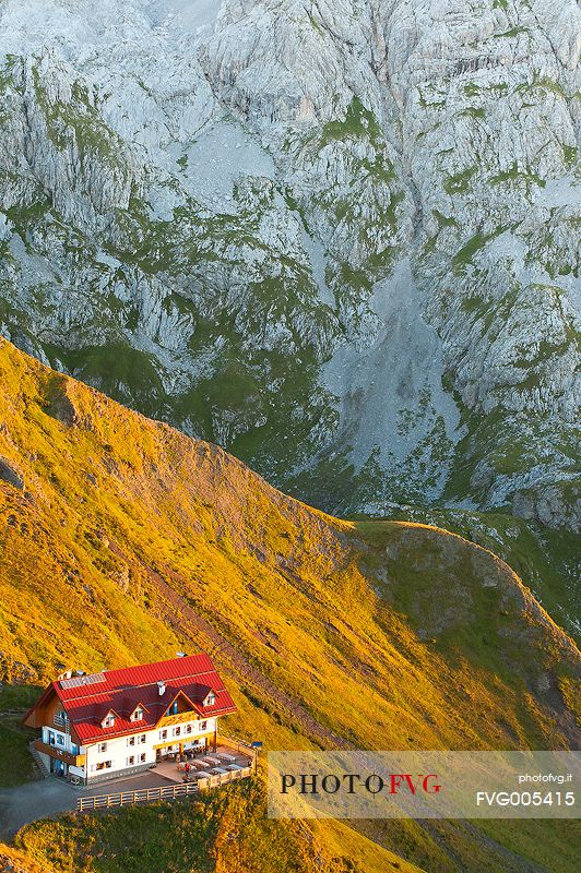 Warm light of sunrise lights-up the Marinelli refuge