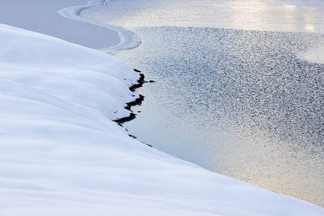 the alpine lake from the grip of ice