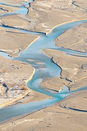 The crystal and clear waters of Tagliamento river flowing in its wild and wonderful bed The crystal and clear waters of Tagliamento river flowing in its wild and wonderful bed