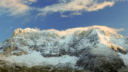 The mount Montasio rises above the beautiful pastures