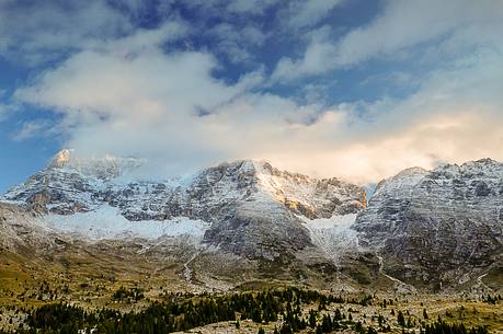 The mount Montasio rises above the beautiful pastures