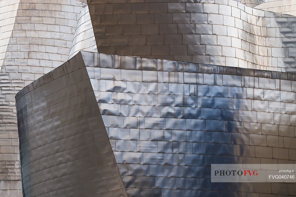 Details of Guggenheim museum in Bilbao. With its interesting color and texture of the walls, great is the contrast between the sharp edges and curved surfaces, Bilbao, Spain