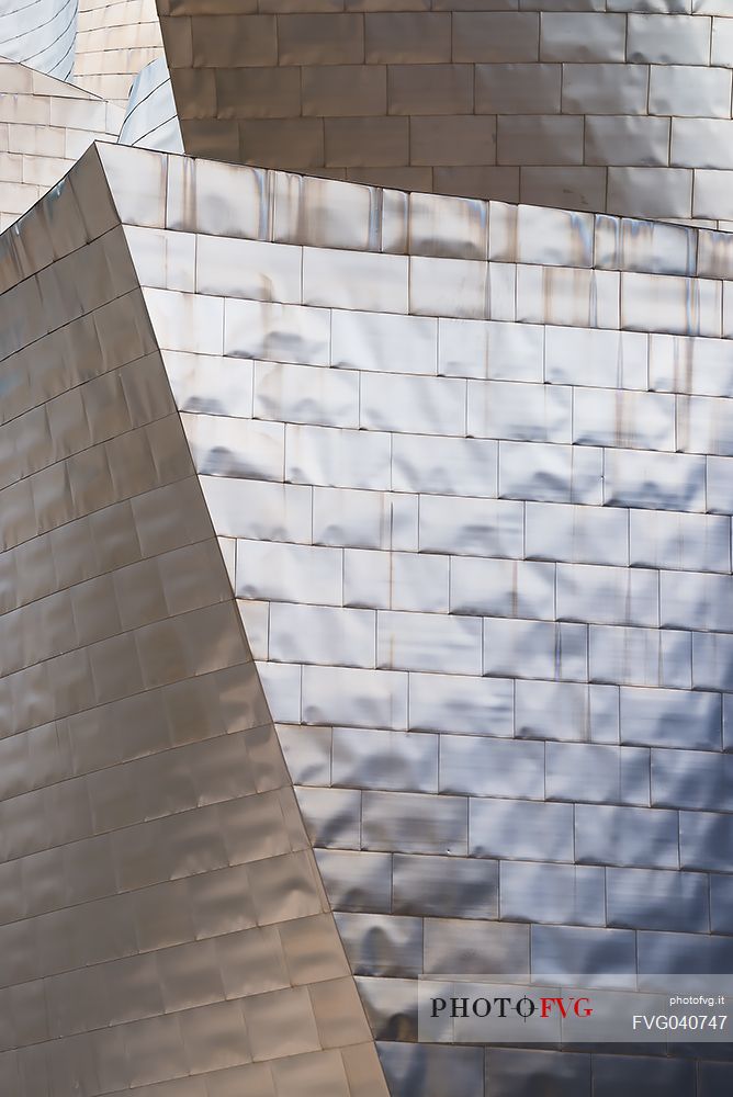 Details of Guggenheim museum in Bilbao. With its interesting color and texture of the walls, great is the contrast between the sharp edges and curved surfaces, Bilbao, Spain