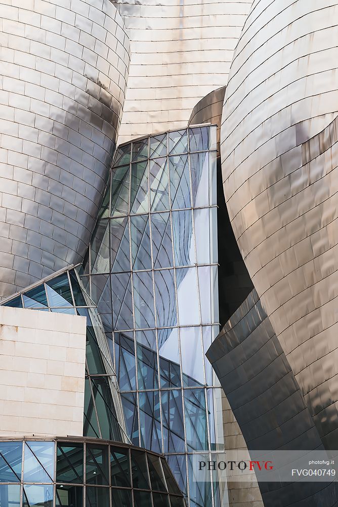 Details of Guggenheim museum in Bilbao. With its interesting color and texture of the walls, great is the contrast between the sharp edges and curved surfaces, Bilbao, Spain