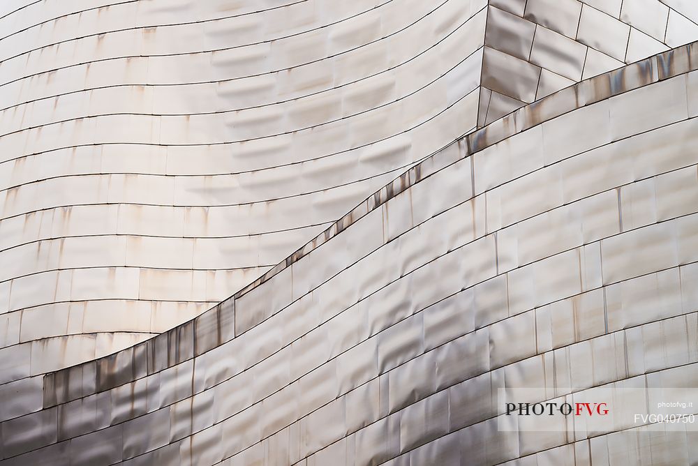 Details of Guggenheim museum in Bilbao. With its interesting color and texture of the walls, great is the contrast between the sharp edges and curved surfaces, Bilbao, Spain