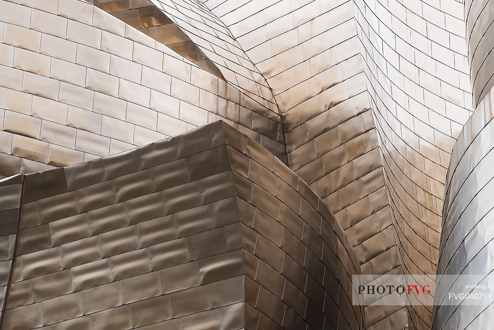 Details of Guggenheim museum in Bilbao. With its interesting color and texture of the walls, great is the contrast between the sharp edges and curved surfaces, Bilbao, Spain