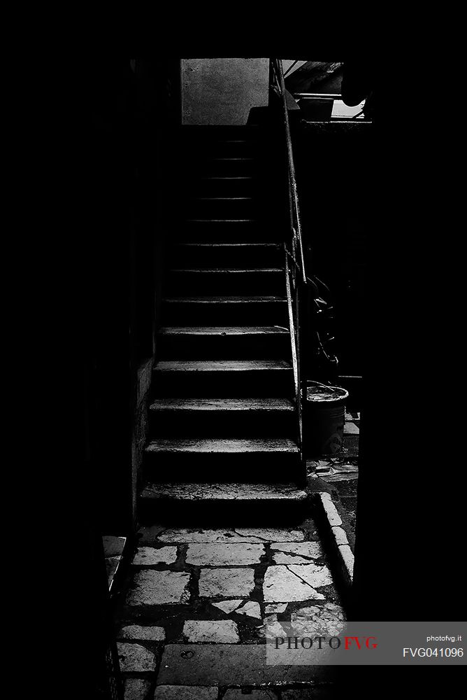 Stair in a dark alley of Venice, Italy