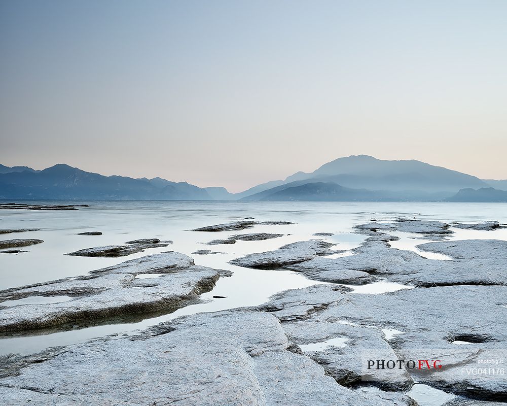 Garda lake at twilight from Sirmione, in the background the Monte Baldo mount, Brescia, Lombardy, Italy, Europe