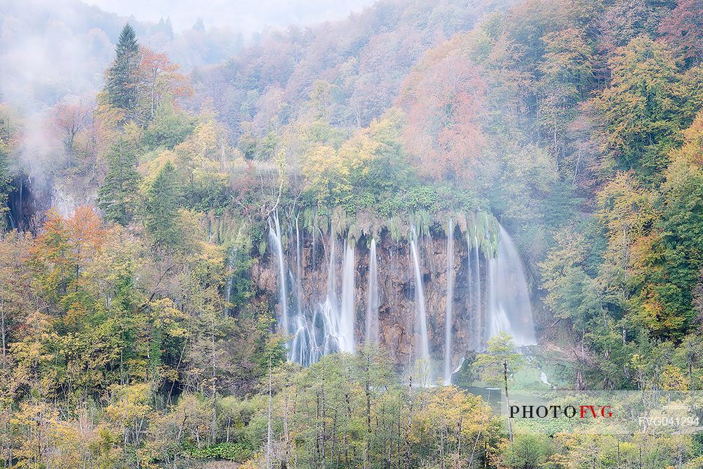 A vision of a waterfall in the colorful autumn forest in the Plitvice national park, Dalmatia, Croatia, Europe