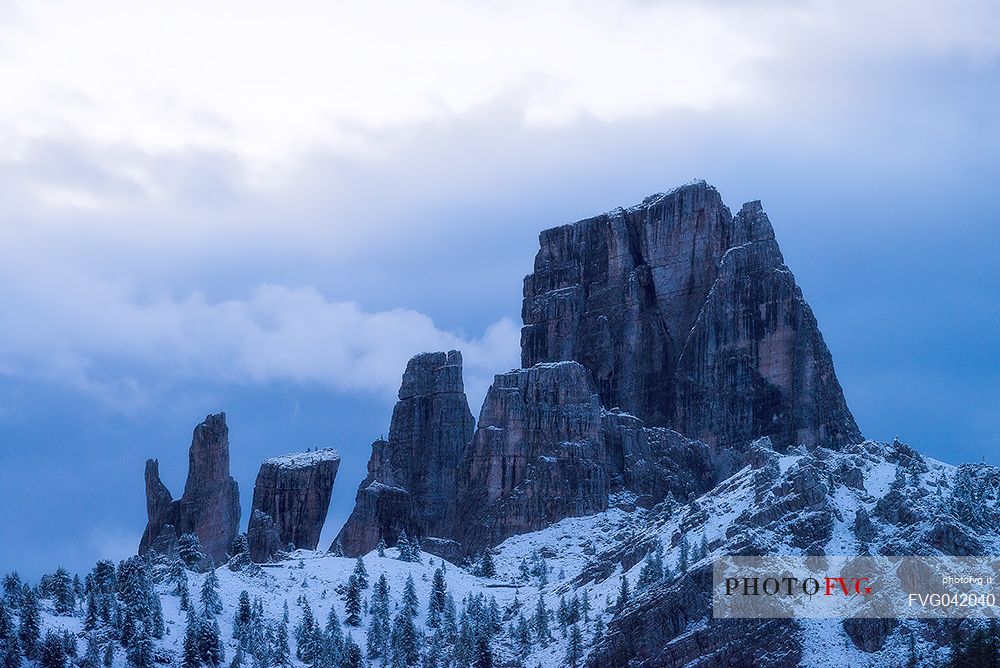 The light before dawn toward the snowy Cinque Torri peak from Falzarego pass, Cortina d'Ampezzo, dolomites, Veneto, Italy, Europe