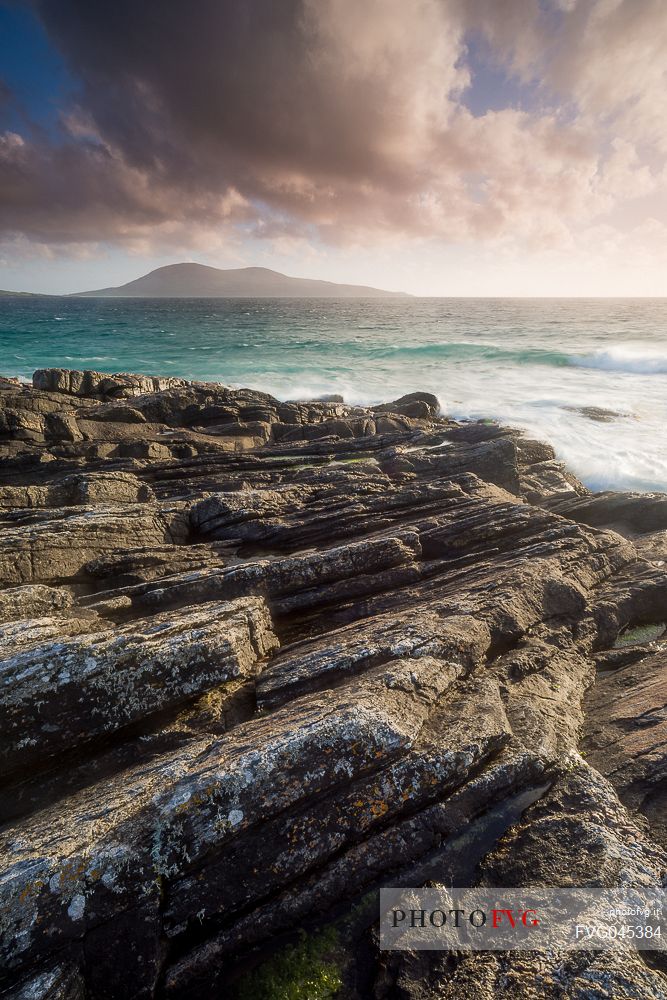 Sunset on the rocks near Na-Buirgh in the Outer Hebrides on the Isle of Harris, Scotland.