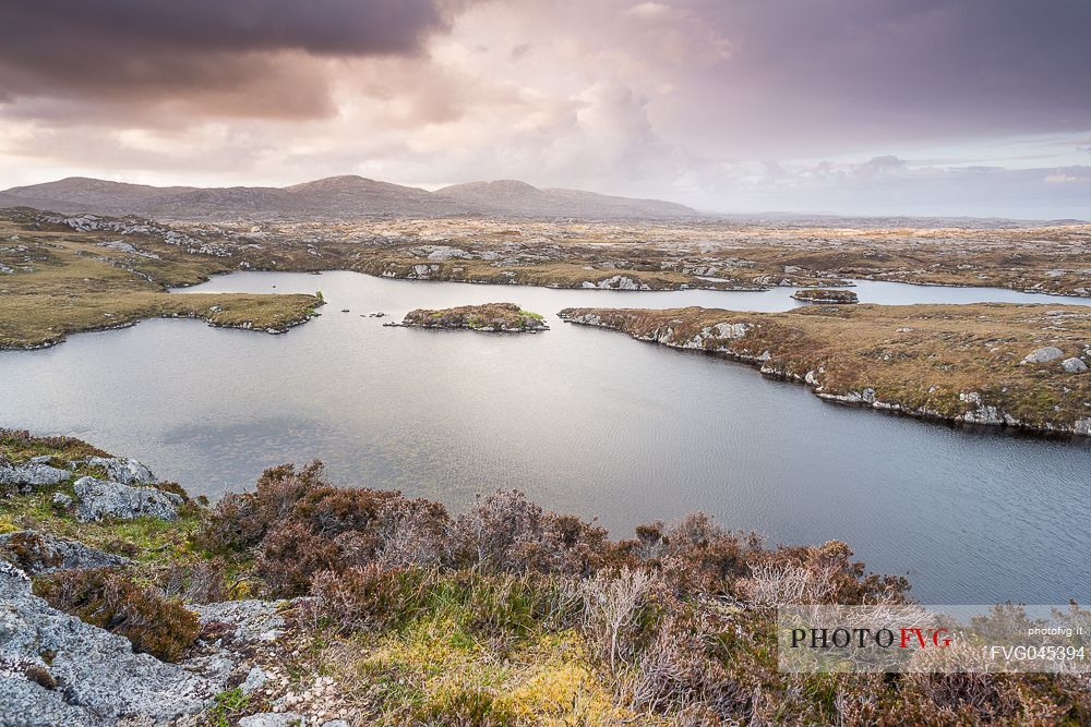 Sunset near Finsbay between Loch Meurach and Loch a 'Gheoidh in the Outer Hebrides on the Isle of Harris, Scotland.