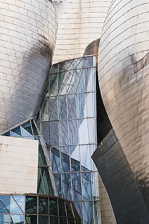 Details of Guggenheim museum in Bilbao. With its interesting color and texture of the walls, great is the contrast between the sharp edges and curved surfaces, Bilbao, Spain