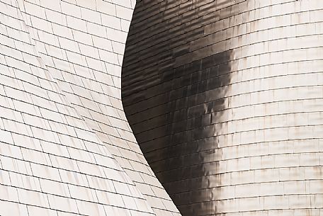 Details of Guggenheim museum in Bilbao. With its interesting color and texture of the walls, great is the contrast between the sharp edges and curved surfaces, Bilbao, Spain