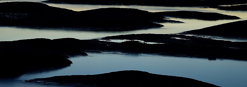 An intimate abstract view of rocks of Garda Lake in Sirmione, Brescia, Lombardy, Italy, Europe