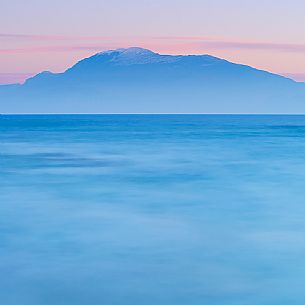 An intimate winter view of Mount Baldo from the coast of Sirmione, Brescia, Lombardy, Italy, Europe