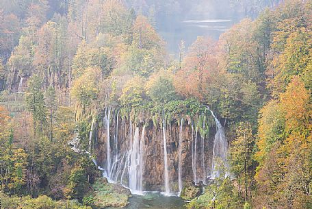 A vision of a waterfall in the colorful autumn forest in the Plitvice national park, Dalmatia, Croatia, Europe