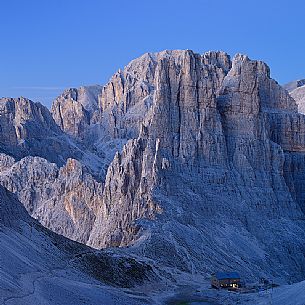 Twilight on the Torri del Violet peak and the hut Re Alberto lighting, Cattinaccio mountain range, fassa valley, dolomites, Trentino Alto Adige, Italy, Europe