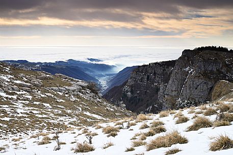 Path from Conca dei Parpari to Malga Pigarolo and Malga Malera alms. Val d'Illasi valley and the Giazza in the background, Lessinia Natural Park, Veneto, Italy, Europe Path from Conca dei Parpari to Malga Pigarolo and Malga Malera alms. Val d'Illasi valley and the Giazza in the background, Lessinia Natural Park, Veneto, Italy, Europe