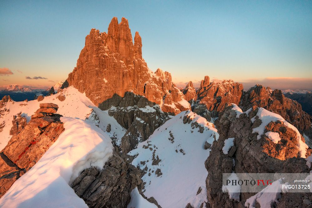 Morning red lights on Monfalconi di Forni mountai chain