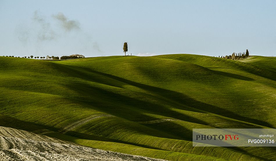 sunrise over the Crete Senesi in a misty morning