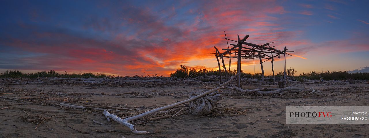 beach panorama whit hand made hut on sunset