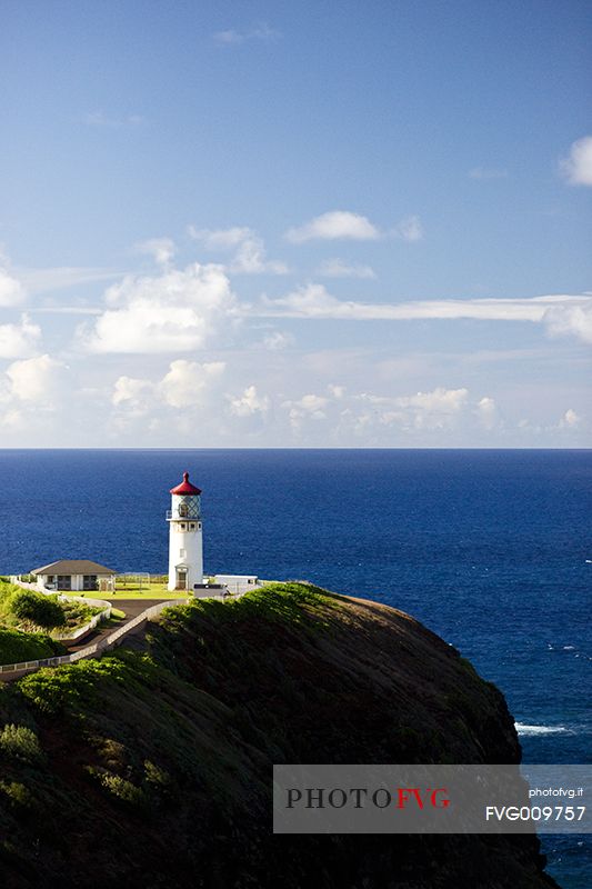 lighthouse on kauai island at sunset